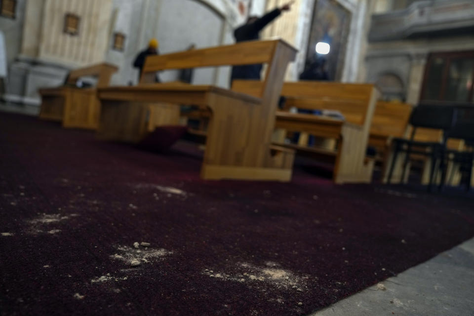 Traces of gunfire appear on the ground of a Roman Catholic church in Istanbul, Turkey Monday, Jan. 29, 2024. The Islamic State group has claimed responsibility for an attack on a Roman Catholic church in Istanbul during a Sunday Mass that killed one person. (AP Photo/Khalil Hamra)