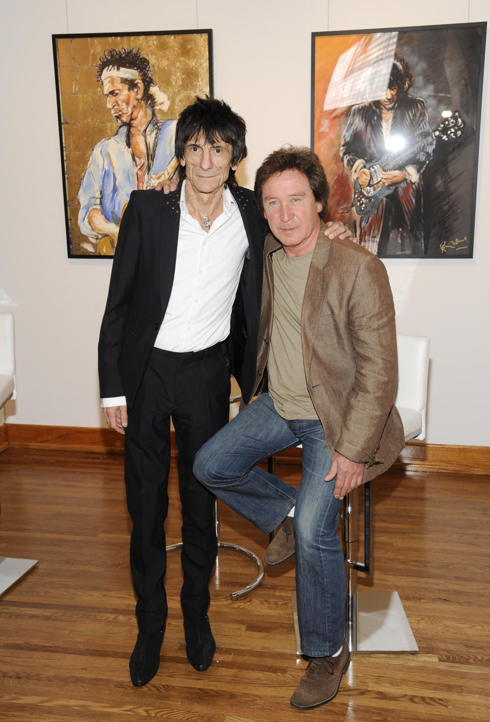 Rolling Stones guitarist Ronnie Wood and drummer Kenney Jones pose for a photo during a news conference unveiling Wood's new art exhibit "Faces, Time and Places" on Monday, April 9, 2012, in New York. (AP Photo/Evan Agostini)