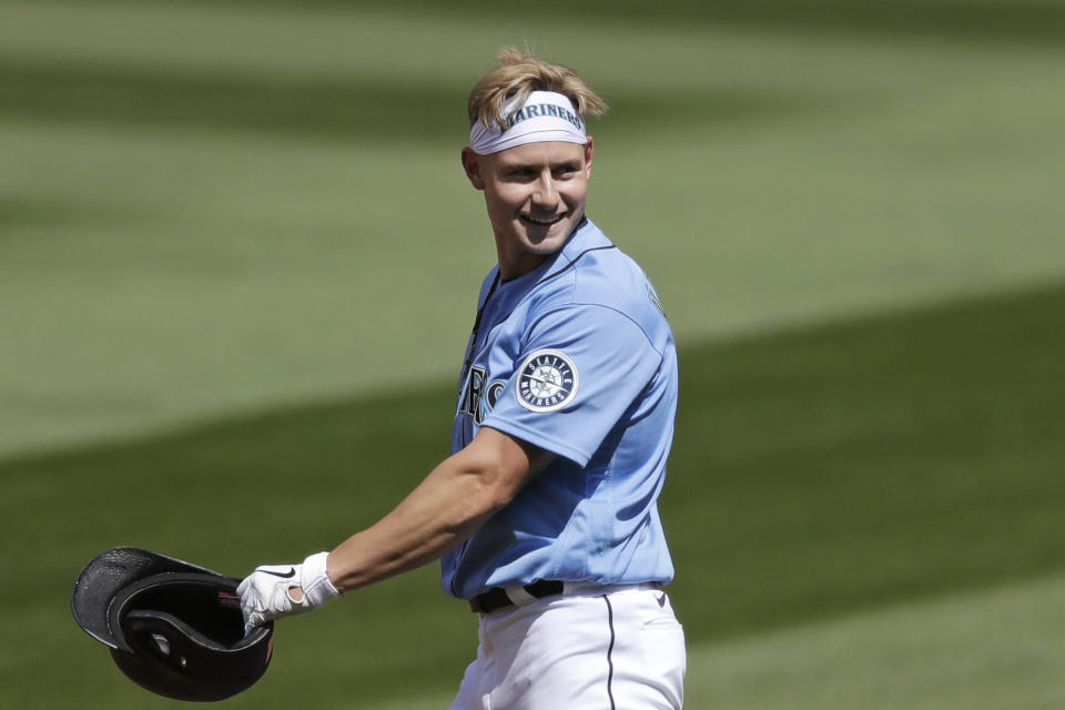 FILE - In this July 12, 2020, file photo, Seattle Mariners' Jarred Kelenic smiles after hitting a double during an intrasquad baseball game in Seattle. Even in a 60-game sprint season, this will not be the year that team comes to fruition. If anything, the truncated season may delay some of the Mariner's rebuilding plans, but still with the optimistic hope the club begins turning the corner into contention in 2021. (AP Photo/Elaine Thompson, File)