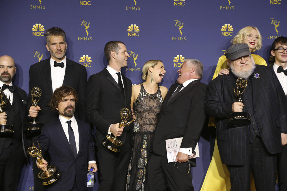 George R.R. Martin and the cast and crew of "Game of Thrones" pose in the press room with the award for outstanding drama series for "Game of Thrones" at the 70th Primetime Emmy Awards on Monday, Sept. 17, 2018, at the Microsoft Theater in Los Angeles. (Photo by Willy Sanjuan/Invision for the Television Academy/AP Images)