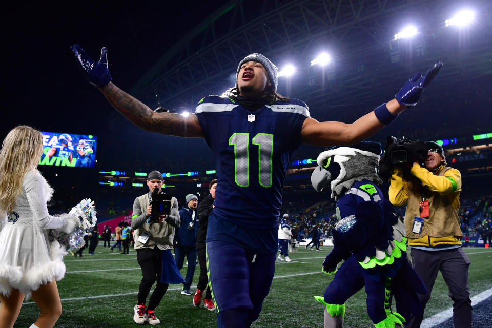 SEATTLE, WASHINGTON – DECEMBER 18: Jaxon Smith-Njigba #11 of the Seattle Seahawks celebrates after a victory against the Philadelphia Eagles at Lumen Field on December 18, 2023 in Seattle, Washington. (Photo by Jane Gershovich/Getty Images)