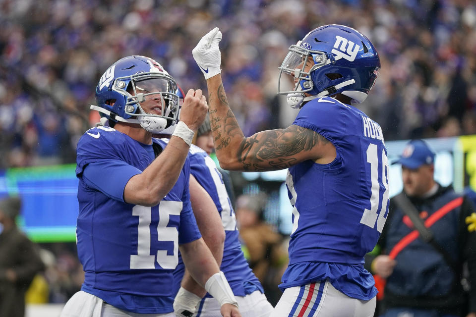 Tommy DeVito (left) isn't just winning games now as the Giants' quarterback, he's a whole vibe. (AP Photo/Bryan Woolston)