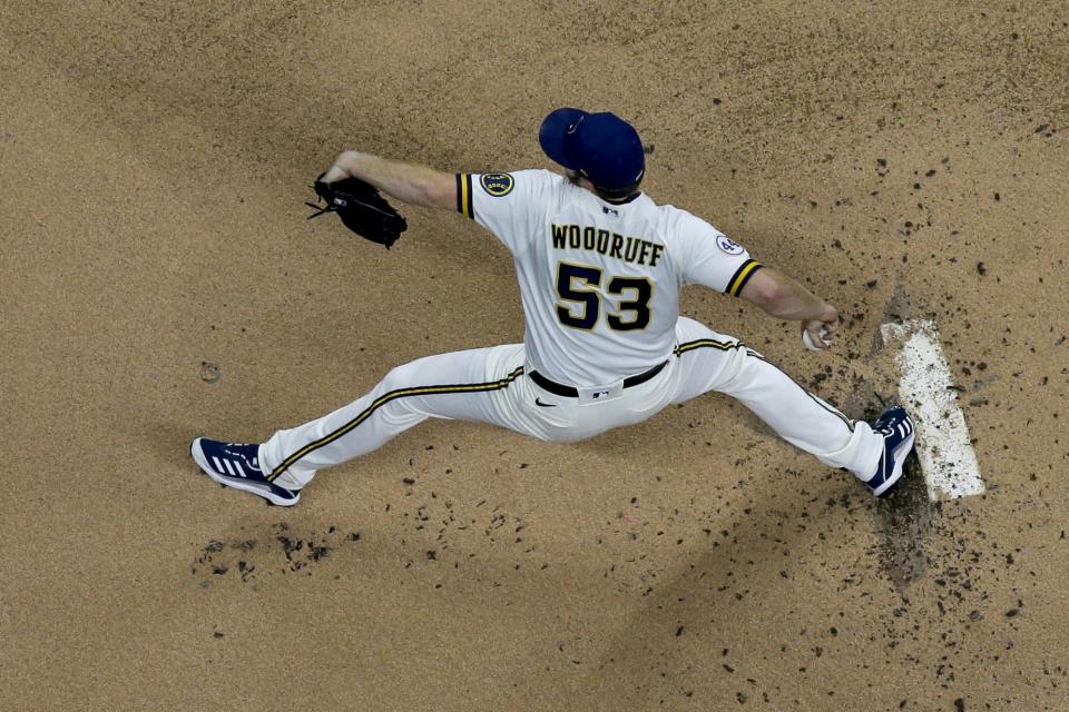 Milwaukee Brewers starting pitcher Brandon Woodruff throws during the first inning of a baseball game against the Chicago Cubs Tuesday, April 13, 2021, in Milwaukee. (AP Photo/Morry Gash)