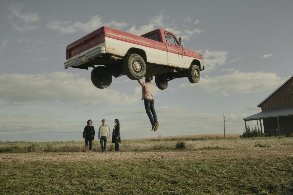 Clark (Tyler Hoechlin) lifts a truck in Superman & Lois. (PHOTO: Warner TV)