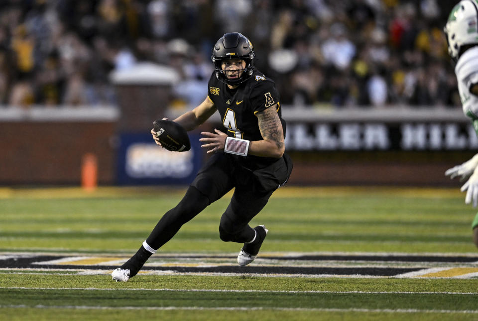 Appalachian State quarterback Joey Aguilar (4) runs the ball during the first half of the team's NCAA college football game against Marshall on Saturday, Nov. 4, 2023, in Boone, N.C. (AP Photo/Matt Kelley)