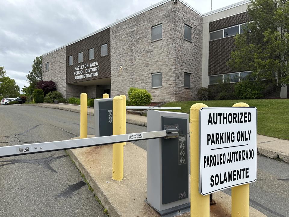 A bilingual sign outside the administration offices of the Hazleton Area School District in Hazleton, Pa., on Thursday, May 16, 2024. About two-thirds of district students are Latino, and a federal lawsuit argues that the way representatives are elected to the Hazleton Area School Board is unfairly shutting Latino voters out of power. (AP Photo/Mark Scolforo)