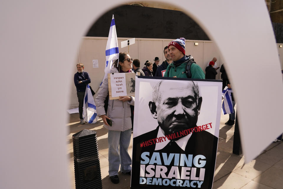 Protestors demonstrate during the visit of Israeli Prime Minister Benjamin Netanyahu to 10 Downing Street in London, Friday, March 24, 2023.(AP Photo/Alberto Pezzali)