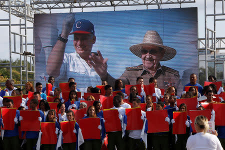 Cuba's First Secretary of the Communist Party and former President Raul Castro (R) and Cuba's President Miguel Diaz-Canel are seen on the screen during the May Day rally in Havana, Cuba, May 1, 2018. REUTERS/Stringer