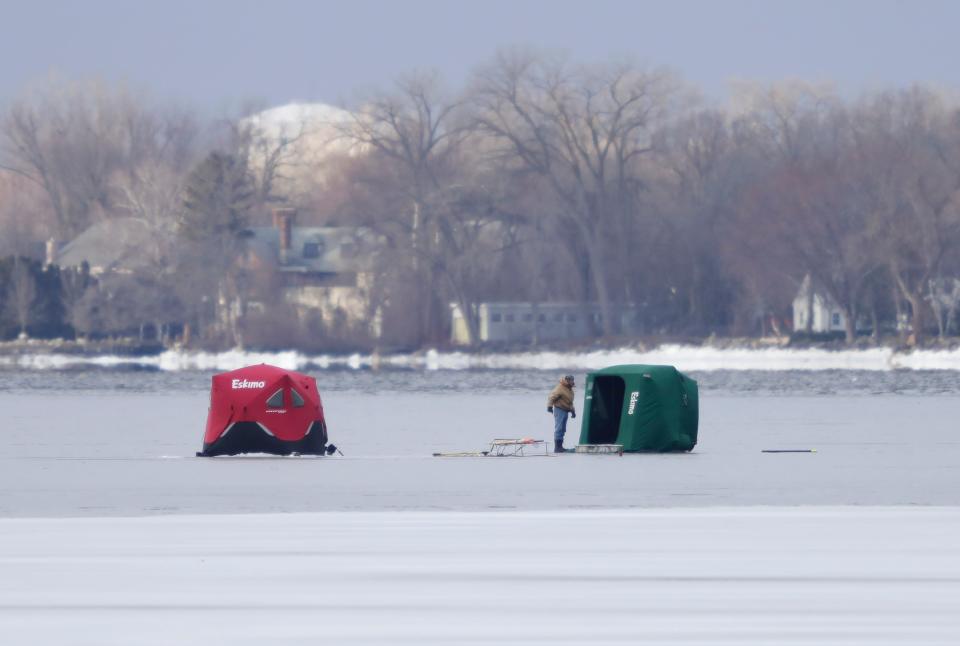 Portable tents are set up a few hundred yards off shore by Waverly Beach Bar & Grille at the start of the 2024 sturgeon spearing season on Lake Winnebago Saturday, February 10, 2024, in Menasha, Wis.