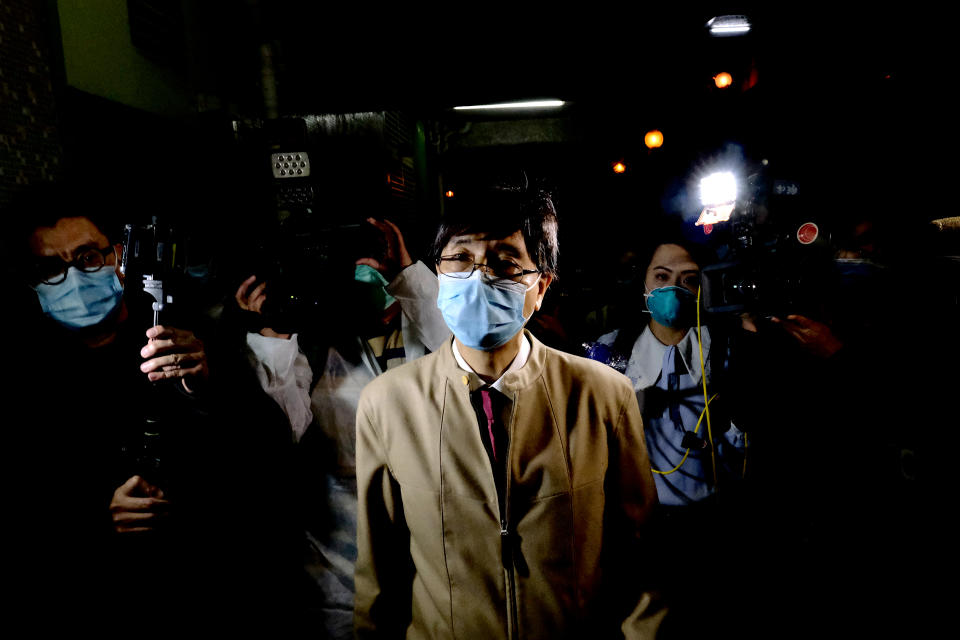 Journalists are seen surrounding Professors Yuen Kwok Yung as he leaves Heng Tai House in Fu Heng Estate where two people living in the building was diagnosed with the Covid-19 on March 14, 2020 in Hong Kong, China. The Coronavirus or Covid-19 which originated from Wuhan China have infected over 120,000 and killed 4617 worldwide, The World Health Organization (WHO) has declared the Covid-19 to be an Outbreak, the government have decided to evacuate some residents in Heng Tai House after two resident tested positive for the Covid-19. (Photo by Vernon Yuen/NurPhoto)