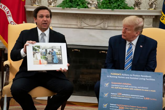President Donald Trump listens as Gov. Ron DeSantis talks about the coronavirus response during a meeting in the Oval Office of the White House on April 28, 2020. (Photo: Evan Vucci/Associated Press)
