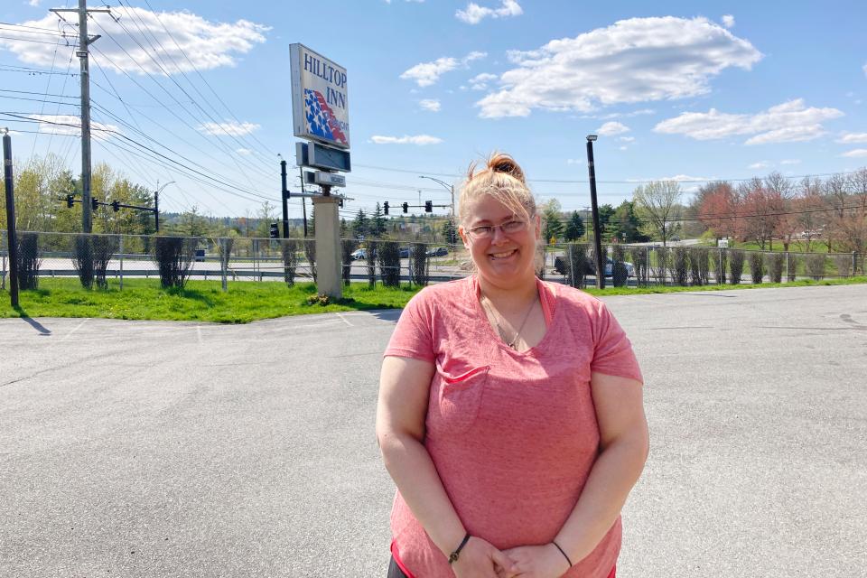 Brittany Plucas stands, Tuesday, May 9, 2023, outside the Hilltop Inn in Berlin, Vt., where she and her boyfriend have been staying since they became homeless in April 2023. Vermont’s pandemic-era expansion of the emergency housing program is ending soon and Plucas and her boyfriend will likely sleep in her car.