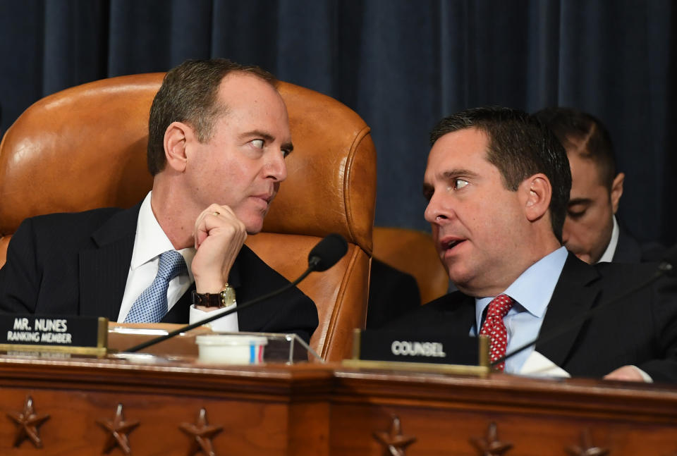 House Intelligence Committee Chairman Adam Schiff (D-Calif.), left, talks with ranking member Rep. Devin Nunes (R-Calif.) on the first day of public impeachment inquiry testimony on Wednesday. (Photo: The Washington Post via Getty Images)