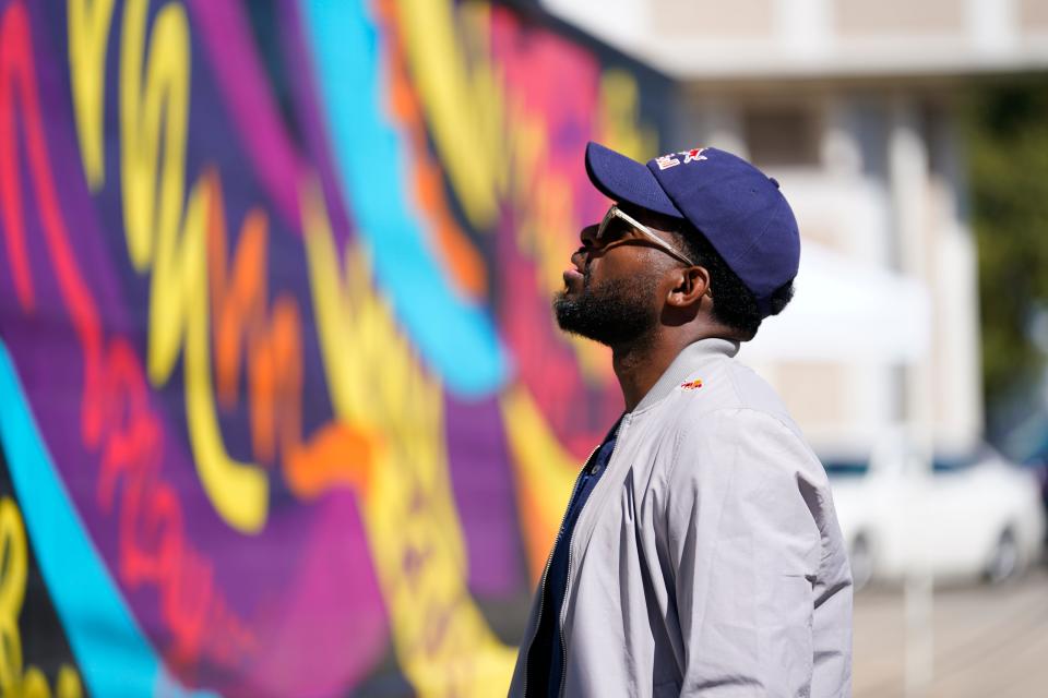 P.K. Subban of the New Jersey Devils looks at one of the murals painted by artists Yasmin De Jesus, Malcolm Rolling, and Matthew Purefoy around the Sharpe James Kenneth A. Gibson Recreation Center on Monday, Sept. 27, 2021, in Newark. 