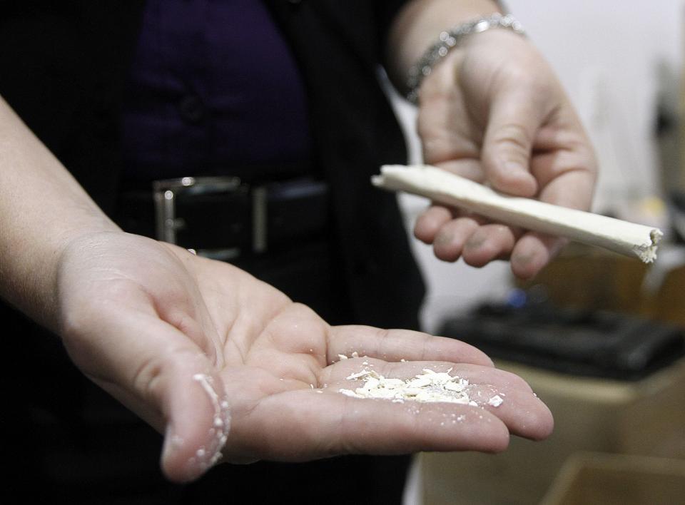 Rep. Mark Genda hopes to provide Hoosiers with water cremation options that are said to be more environmentally friendly. Samantha Wilson of Bio-Response Solutions holds the remains of a bone from a pig carcass o, that was disposed of using this process.