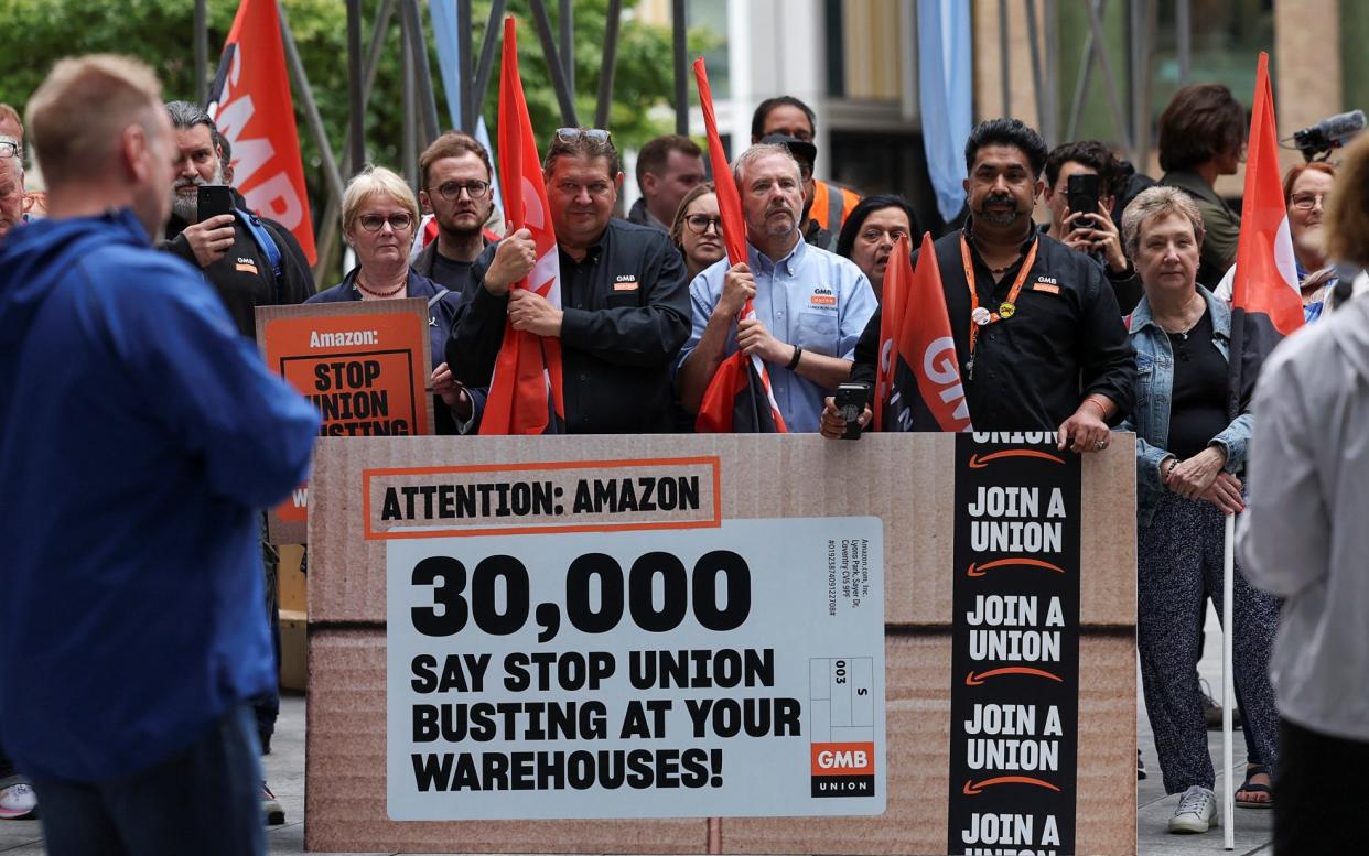 Demonstrators attend a protest outside the Amazon headquarters