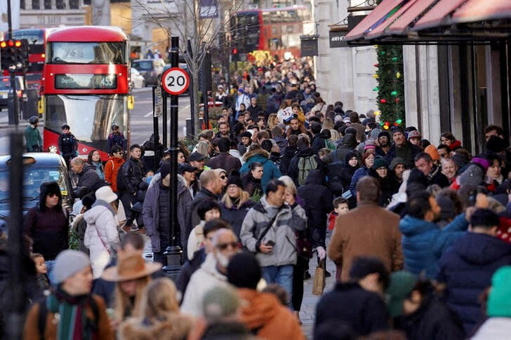 FILE PHOTO: Shoppers hit the Boxing Day sales in London