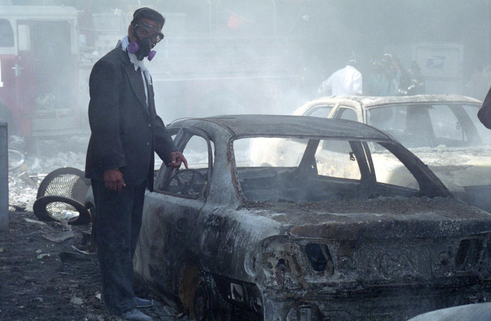 The burnt out wreckage of a car which was crushed when the building collapsed. (Caters)