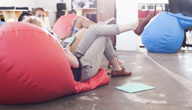 Business people sitting in bean bag chairs