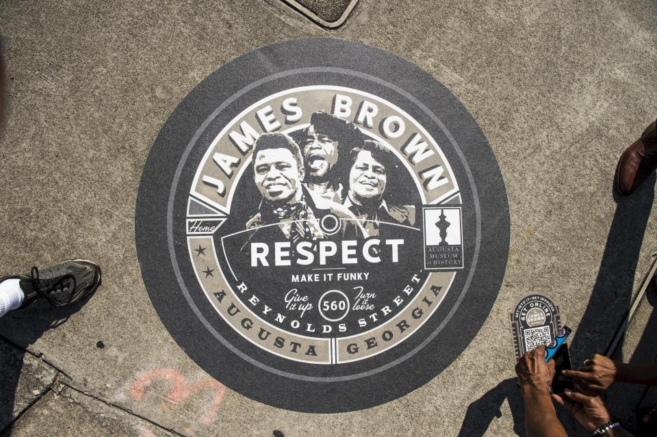The Soul Starts Here James Brown Journey is a walking or driving tour in honor of James Brown. At each location, an artistic depiction of a vinyl record is placed on the sidewalk telling the story the location had in the life of James Brown.  This is the record that was unveiled along Broad Street near the 6th Street intersection in Augusta, Ga., Wednesday morning August 12, 2020.