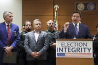 Florida Gov. Ron DeSantis speaks during a news conference at the Broward County Courthouse in Fort Lauderdale, Fla. on Thursday, Aug. 18, 2022. Florida Gov. Ron DeSantis on Thursday announced criminal charges against 20 people for illegally voting in 2020, the first major public move from the Republican's new election police unit. (Amy Beth Bennett/South Florida Sun-Sentinel via AP)
