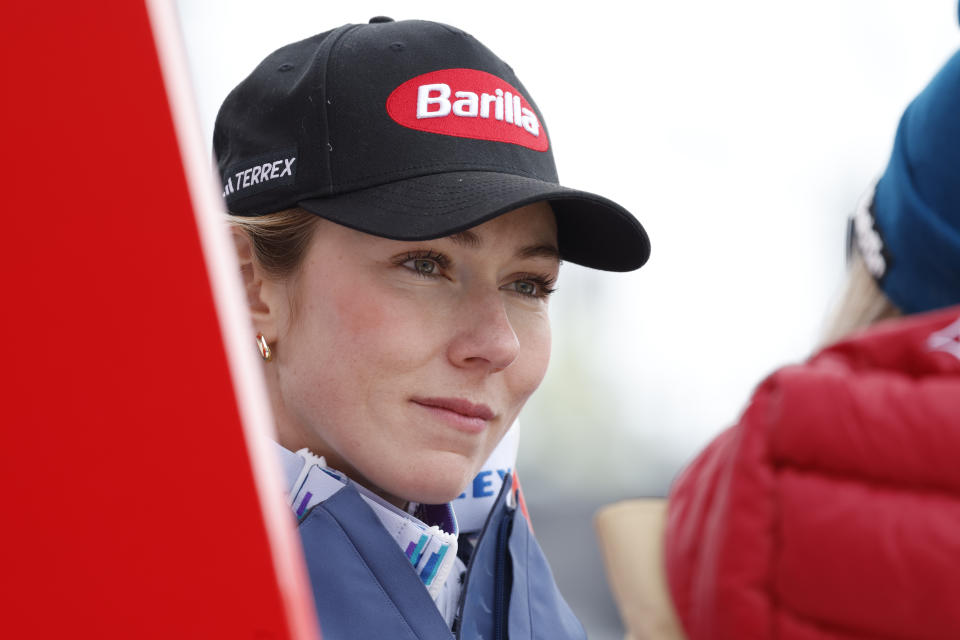 United States' Mikaela Shiffrin listens at the finish area of an alpine ski, women's World Cup downhill race, in St. Moritz, Switzerland, Saturday, Dec.9, 2023. (AP Photo/Alessandro Trovati)