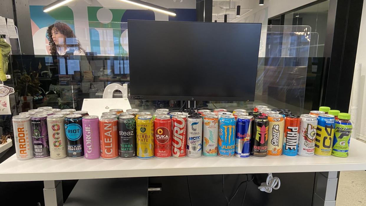 a shelf with cans of soda on it