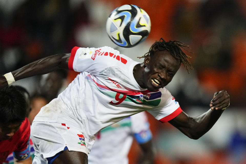 Gambia's Mansour Mbye goes for a header during a FIFA U-20 World Cup Group F soccer match against South Korea at the Malvinas Argentinas stadium in Mendoza, Argentina, Sunday, May 28, 2023. (AP Photo/Natacha Pisarenko)