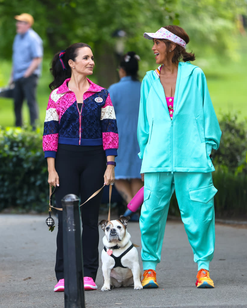 Kristin Davis and Nicole Ari Parker are seen on the set of "And Just Like That, Cast on the set of And Just Like That... Season 3 filming, costumes, fashion, outfits, dog