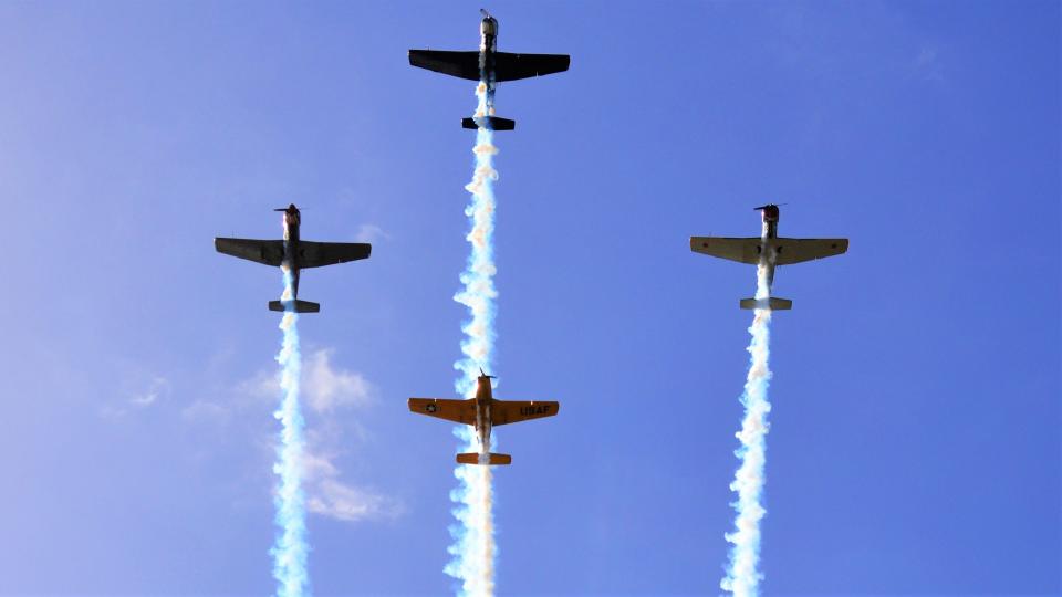 Four planes fly in formation overhead as part of opening ceremonies on Sunday at the 27th annual concours d'elegance at Amelia Island.