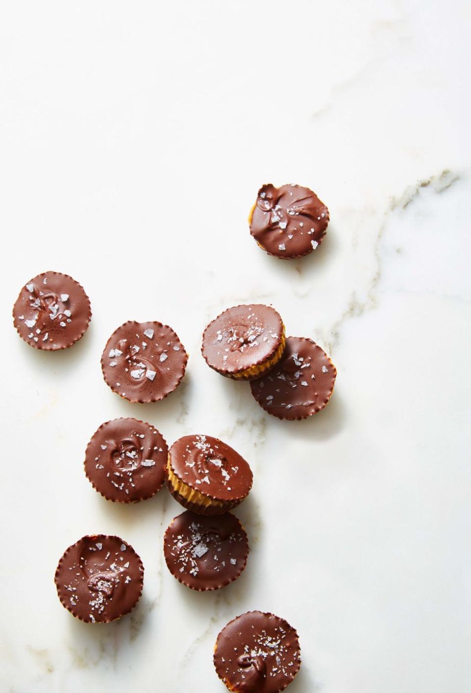 <p>Mashed banana makes these 4-ingredient candies naturally sweet.</p><p><em><a href="https://www.goodhousekeeping.com/food-recipes/a34821799/sea-salt-nut-butter-cups-recipe/" rel="nofollow noopener" target="_blank" data-ylk="slk:Get the recipe for Sea-Salted Nut Butter Cups »;elm:context_link;itc:0;sec:content-canvas" class="link ">Get the recipe for Sea-Salted Nut Butter Cups »</a></em></p>