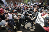 <p>White nationalists, neo-Nazis and members of the “alt-right” clash with counterprotesters as they enter Emancipation Park during the “Unite the Right” rally, Aug.12, 2017 in Charlottesville, Va. (Photo: Chip Somodevilla/Getty Images) </p>