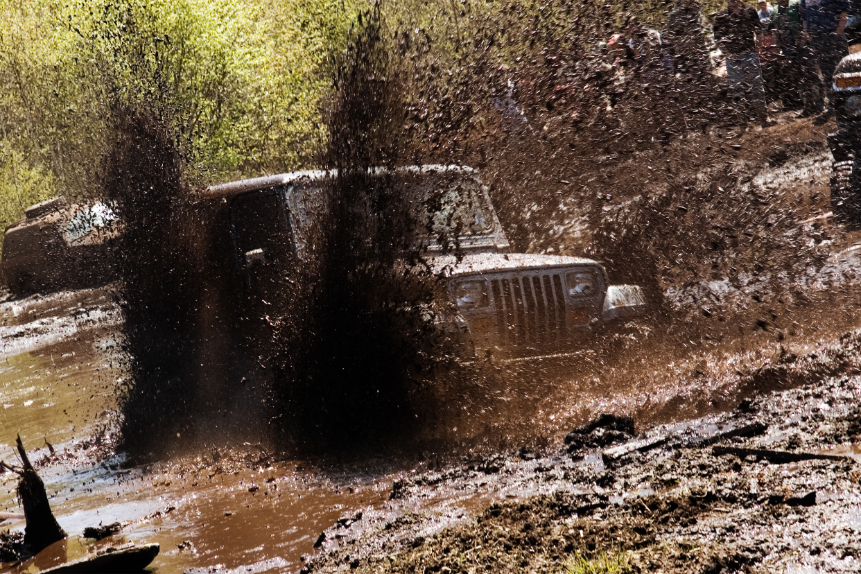 four wheeler in the mud