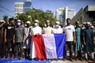 Supporters of several Islamist parties protest after Friday prayers in Dhaka, Bangladesh, Friday, Oct. 30, 2020. Thousands of Muslims and activists marched through streets and rallied across Bangladesh’s capital on Friday against the French president’s support of secular laws that deem caricatures of the Prophet Muhammad as protected under freedom of speech. (AP Photo/Mahmud Hossain Opu)