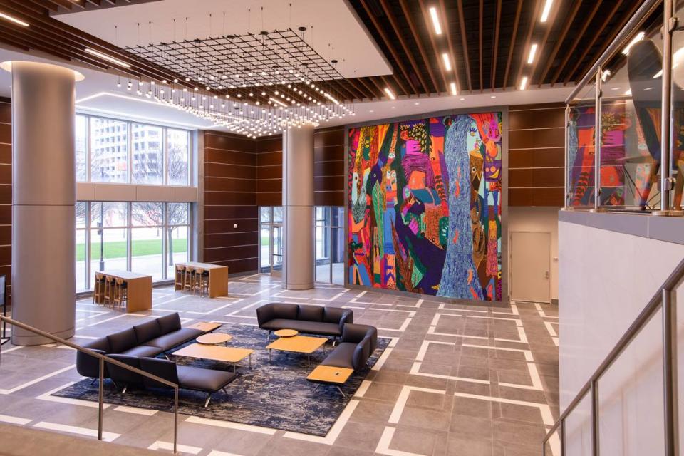 Summer Wheat’s “Waterfalls” installation is in the lobby of an office tower at 650 S. Tryon St. It celebrates North Carolina’s female creators and includes an abstracted figure inspired by Abigail Carter, a Clinton, NC, native who became the first manufacturer of overalls in the U.S.  