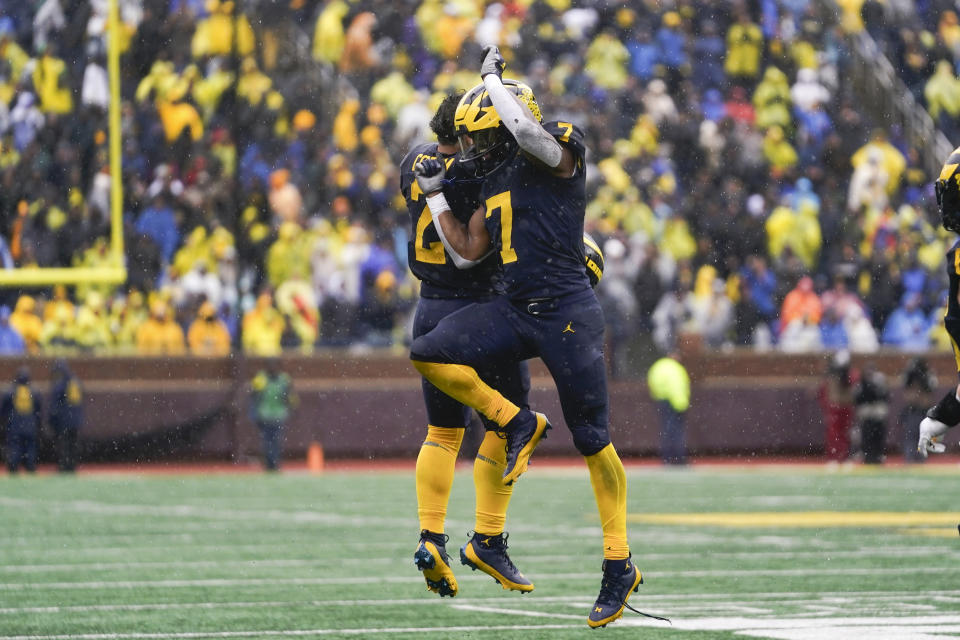 Michigan running back Donovan Edwards (7) celebrates his touchdown with Blake Corum (2) against Indiana in the second half of an NCAA college football game in Ann Arbor, Mich., Saturday, Oct. 14, 2023. (AP Photo/Paul Sancya)