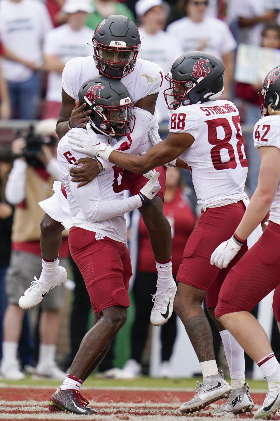 Washington State quarterback Cameron Ward (1) celebrates his passing touchdown to wide receiver Donovan Ollie (6) during the first half of an NCAA college football game against Stanford in Stanford, Calif., Saturday, Nov. 5, 2022. (AP Photo/Godofredo A. Vásquez)
