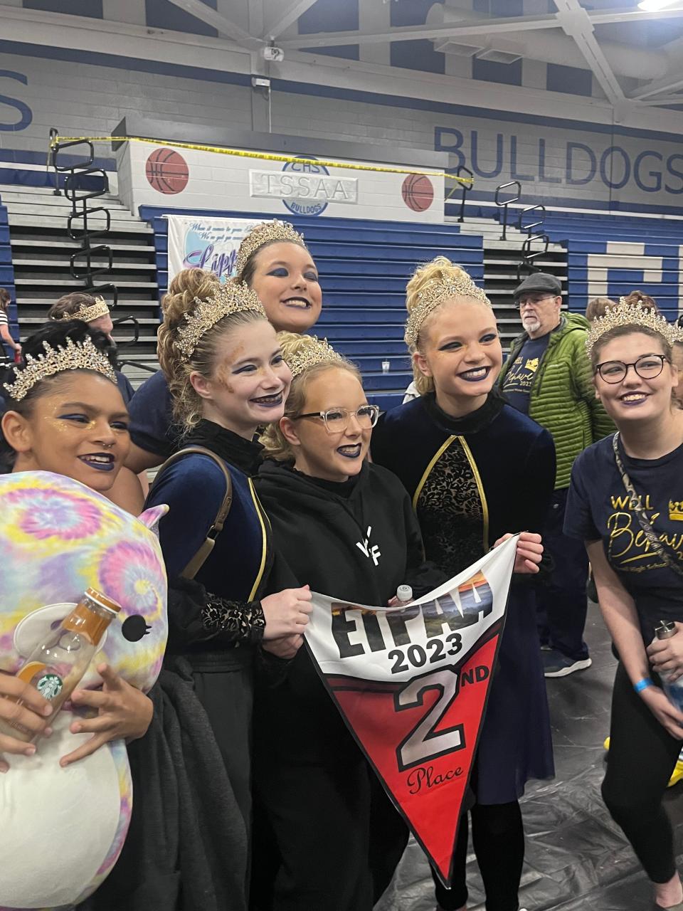 Hailey Whitehouse and her Powell High School teammates celebrate a victory.