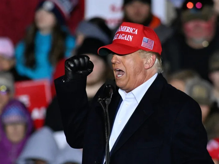A picture of former President Donald Trump at a rally in South Carolina, wearing a MAGA hat