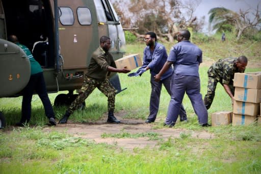 South African military personnel deliver relief aid to Buzi -- just a handful of helicopters are available for this crucial work