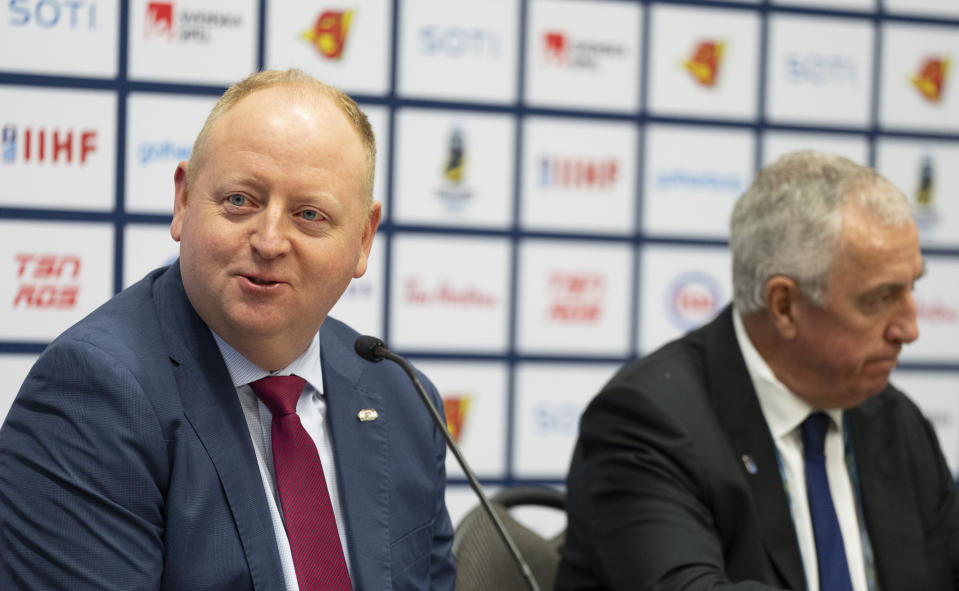 FILE - Pat Kelleher, left, executive director USA Hockey, and IIHF president Luc Tardif, address the media at the IIHF World Junior Hockey Championship in Gothenburg, Sweden, Friday, Jan. 5, 2024. USA Hockey is mandating neck laceration protection for all players under the age of 18, the latest development in the wake of the death of a player in England from a skate cut to the neck. “I know throughout our organization, the overwhelming opinion was that the time is appropriate to modify our rules related to neck laceration protection,” USA Hockey executive director Kelleher said. (Christinne Muschi/The Canadian Press via AP, File)