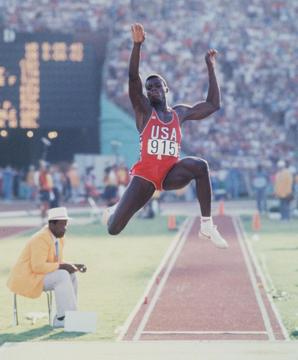 Carl Lewis makes his first jump in the finals of the long jump at the Olympic Games in Los Angeles.