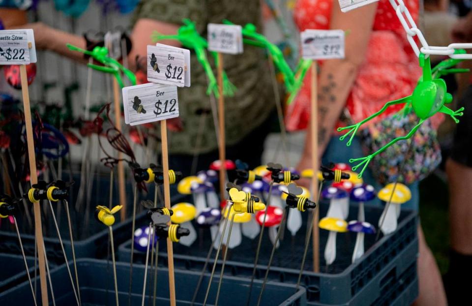 Bees, frogs, mushrooms and more at the Metal Illusions booth at the People’s Choice Festival on Friday, July 14, 2023. All the creations are made from recycled metals and are powder coated to last outside.
