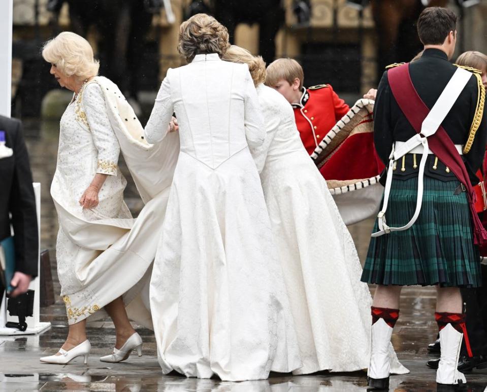 Camilla followed by her Ladies in Attendance