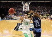<p>Dillon Brooks #24 of the Oregon Ducks drives to the basket against Kuran Iverson #23 of the Rhode Island Rams during the second round of the 2017 NCAA Men’s Basketball Tournament at Golden 1 Center on March 19, 2017 in Sacramento, California. (Photo by Jamie Squire/Getty Images) </p>
