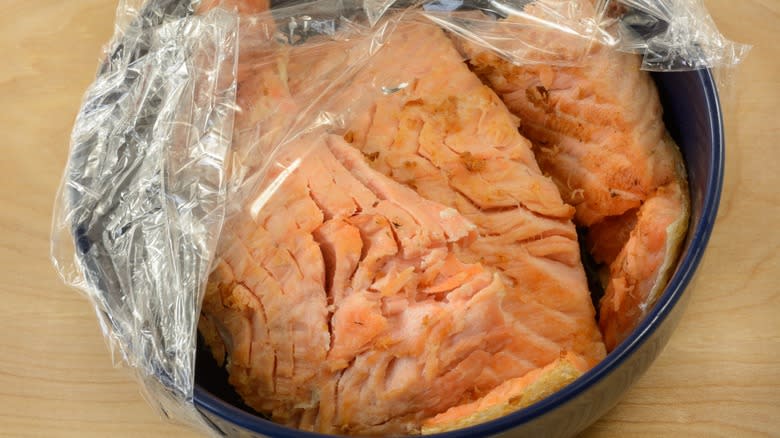 salmon bowl with plastic wrap