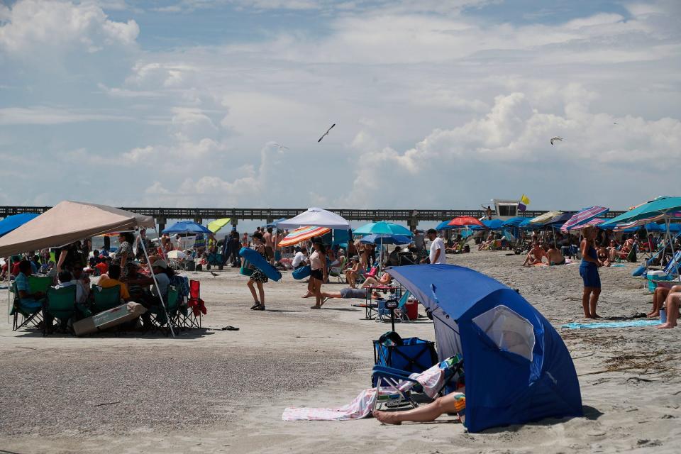 Rows of umbrellas and tents pack in over the Labor Day weekend on Tybee Island.