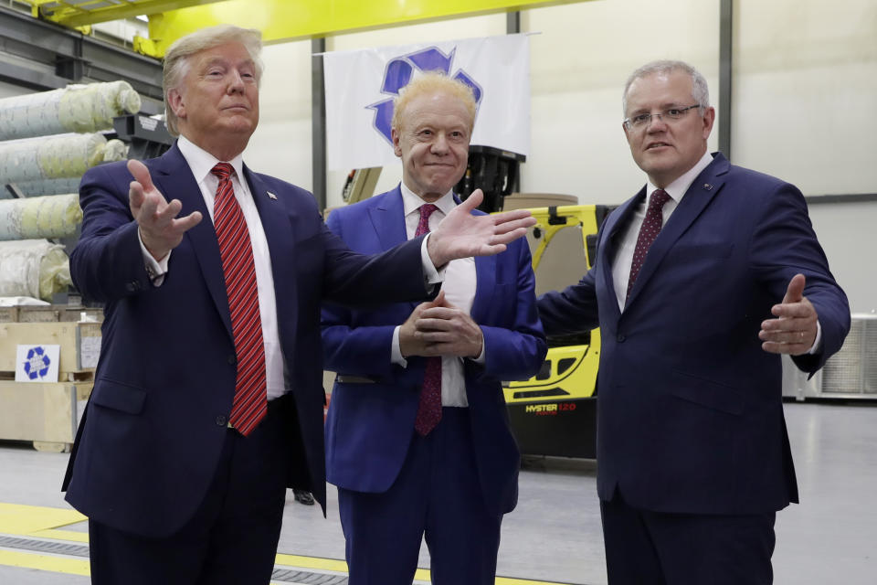 President Donald Trump and Australian Prime Minister Scott Morrison speak as Pratt Industries chairman Anthony Pratt, center, watches during a tour of Pratt Industries, Sunday, Sept 22, 2019, in Wapakoneta, Ohio. (AP Photo/Evan Vucci)