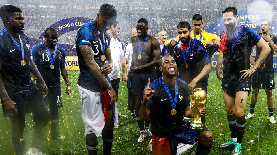 N’Golo Kante (back-left) is looking on as his French teammates post with the cup. Pic: Getty