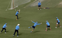 Players of South Africa cricket team warm up during a practice session at the National Cricket Stadium, in Karachi, Pakistan, Saturday, Jan. 23, 2021. South Africa, which arrived in the southern port city of Karachi for the first time in nearly 14 years, will play the first test match against Pakistan starting on Jan. 26. (AP Photo/Fareed Khan)